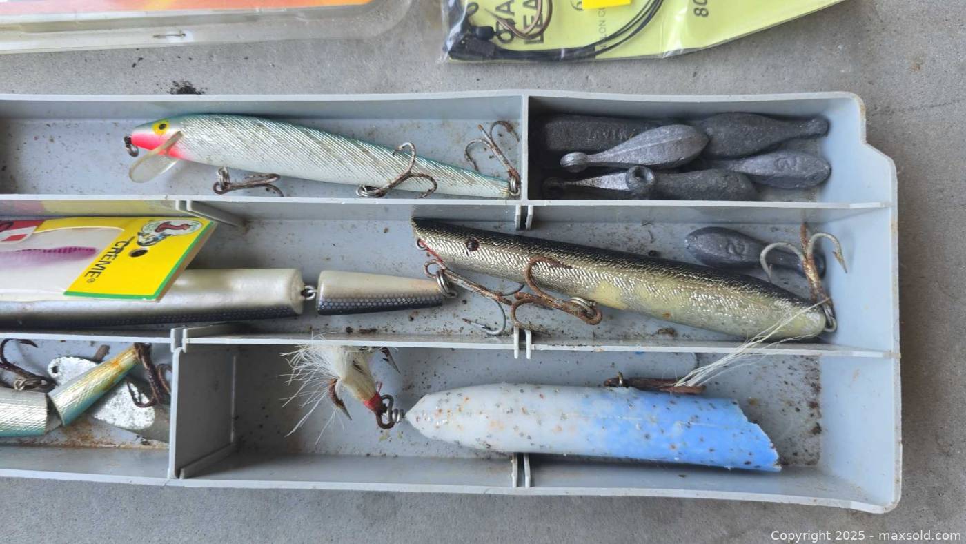 Two tackle boxes with tackle and three fishing rods | Maxsold