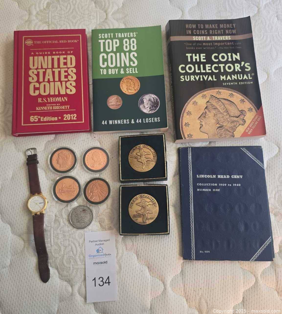 Coin reference books, 7 assorted coins, Bulova watch | Maxsold