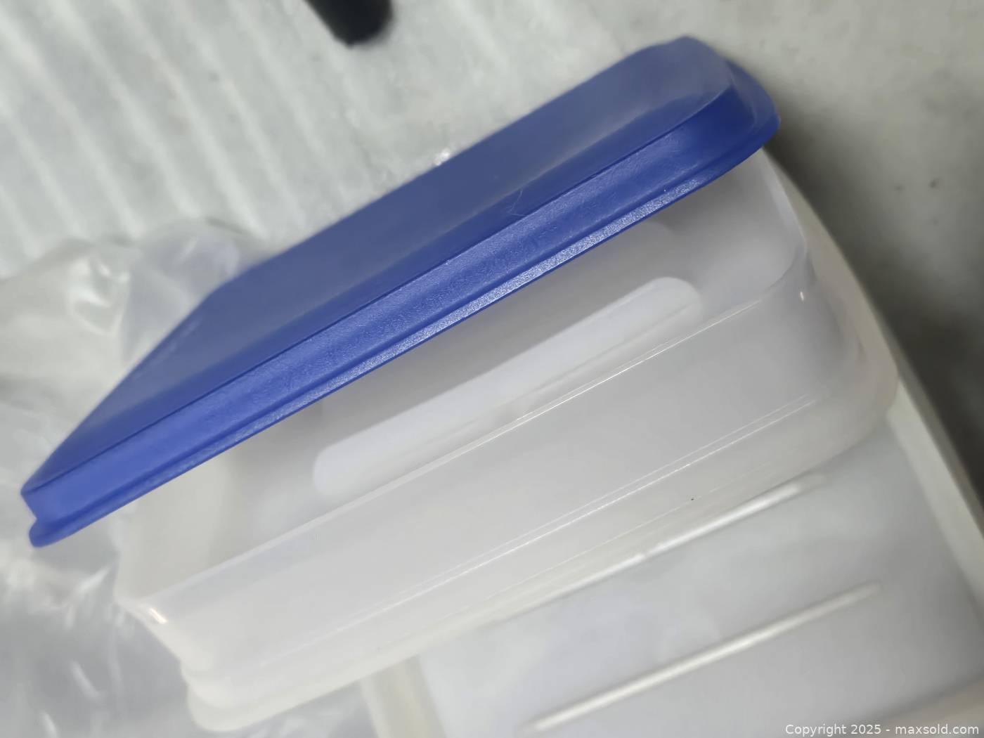 New Tupperware round container and two hot dog containers | Maxsold