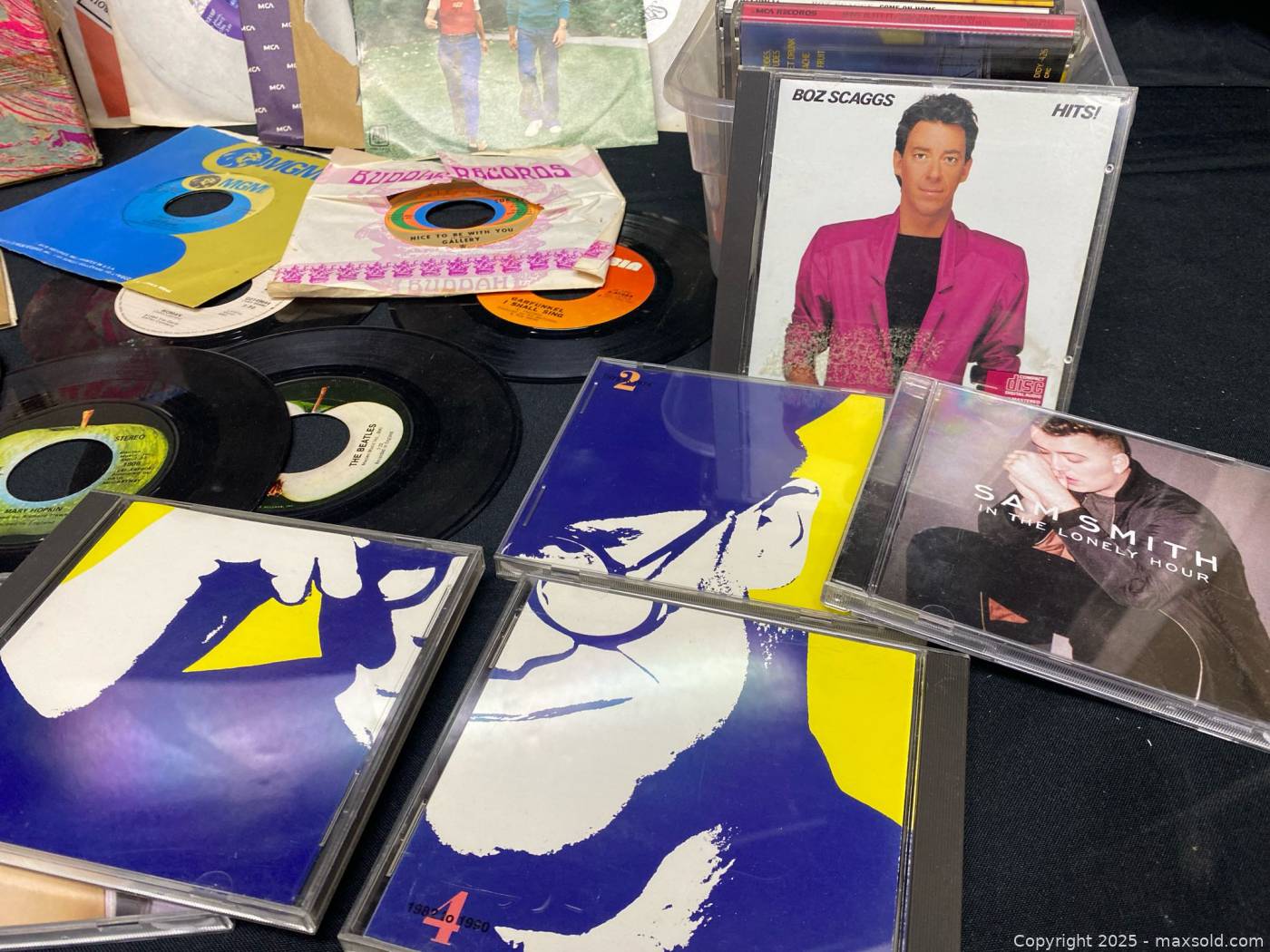 Large lot of 45 RPM vinyl singles and music CDs | Maxsold
