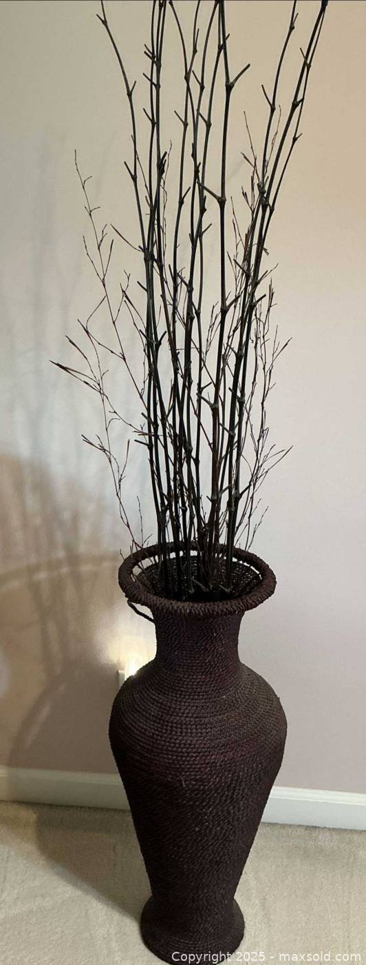 Woven brown floor vase with branches | Maxsold