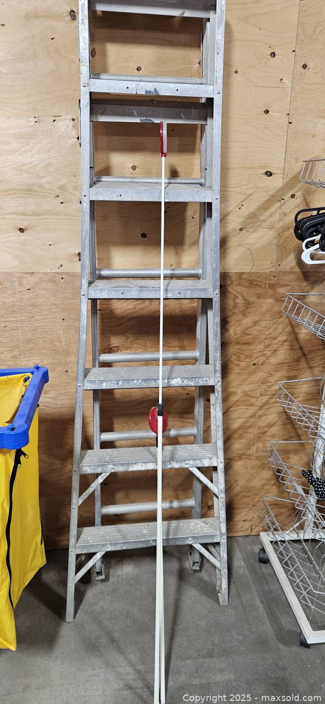 Aluminum step ladder with driveway snow plow markers | Maxsold
