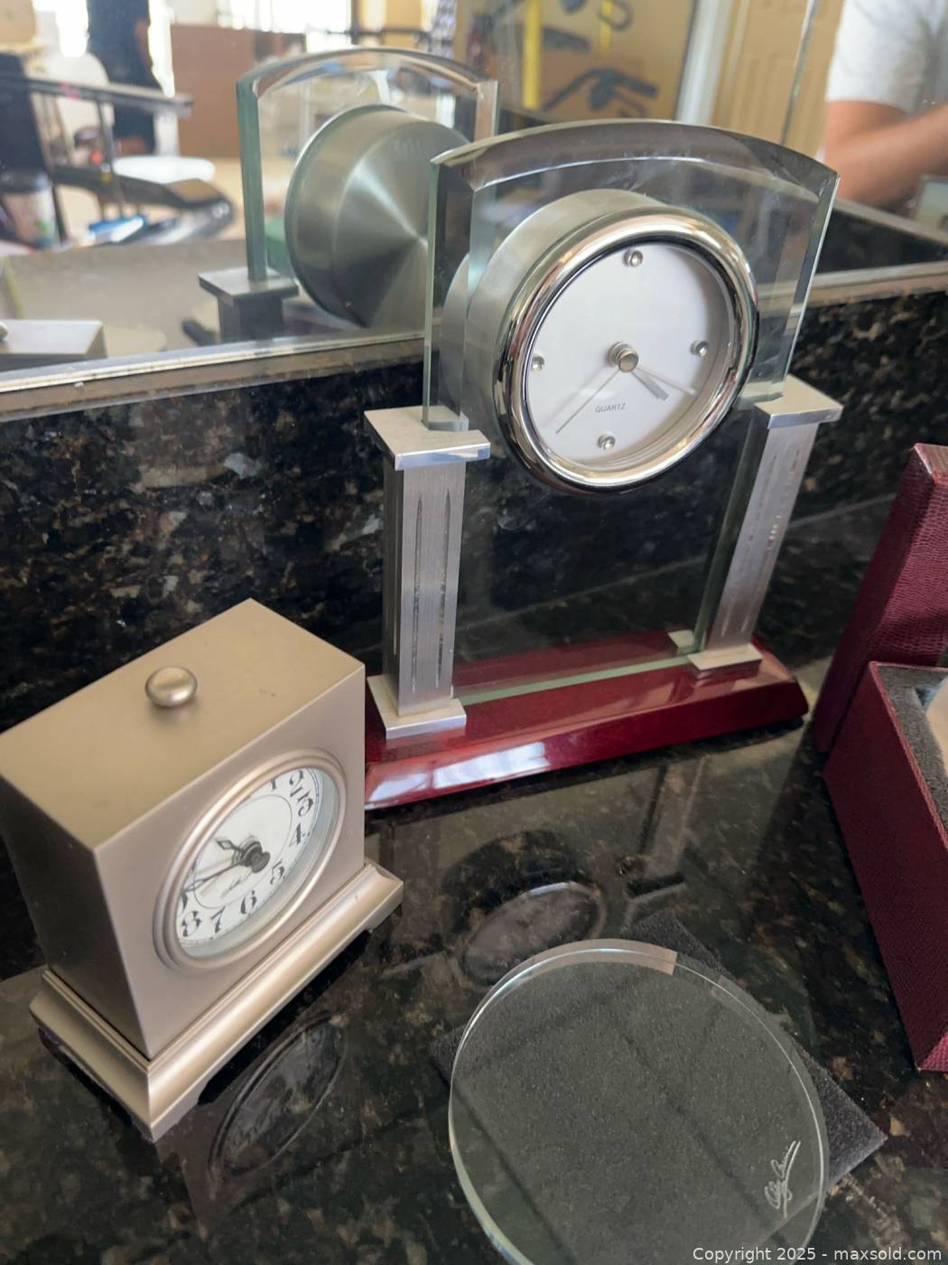 Oleg Cassini crystal coasters and desk clocks | Maxsold
