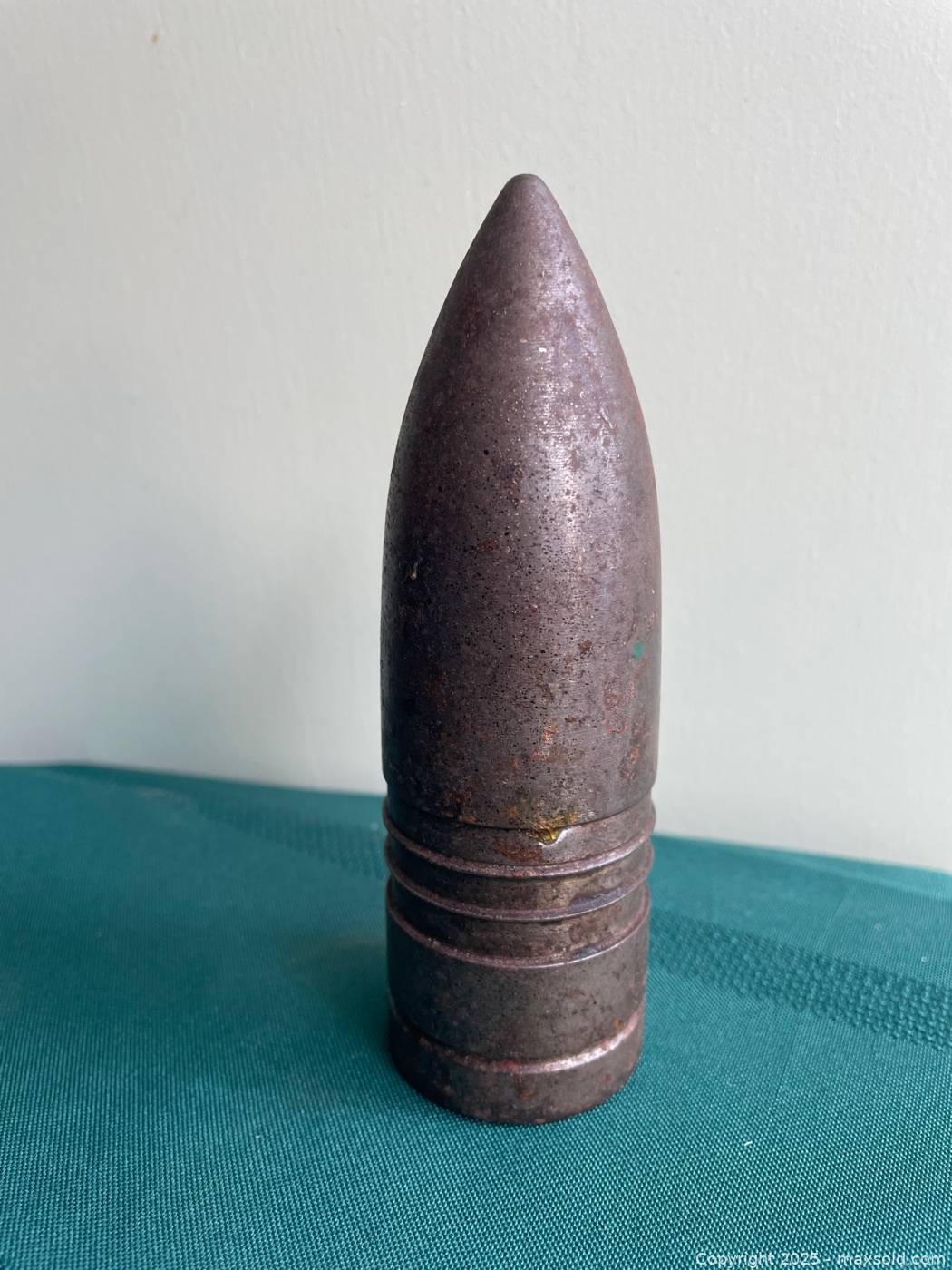 Antique metal artillery shell paperweight | Maxsold