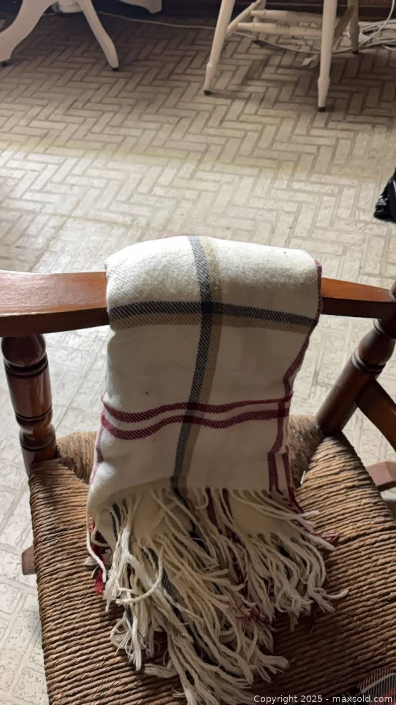 Wood rocking chair with 3 plaid throws | Maxsold