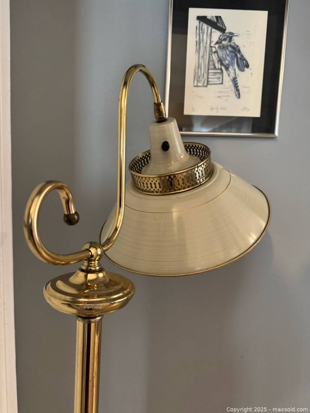 Vintage metal floor lamp with articulating head | Maxsold