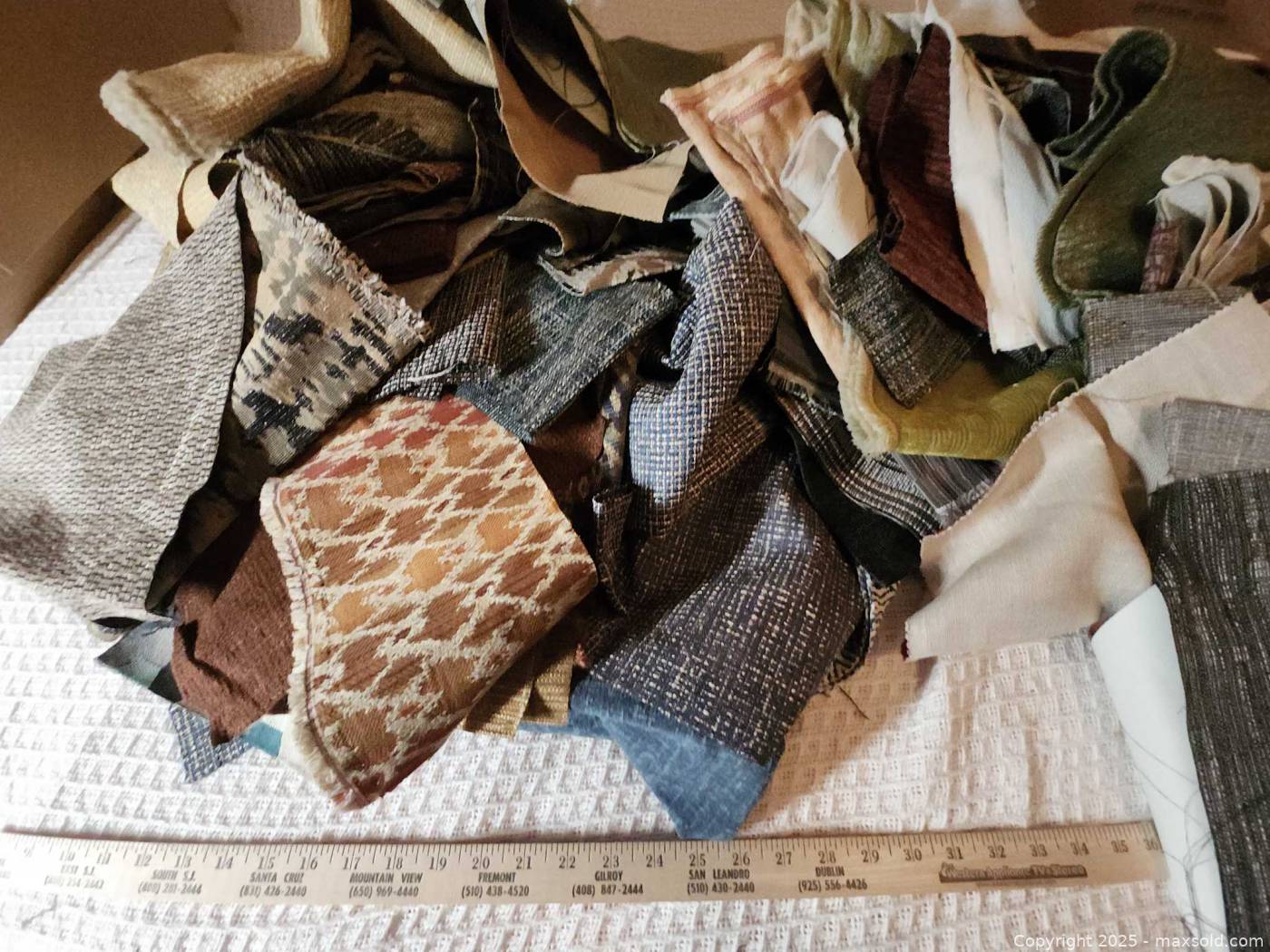 Assorted upholstery fabric scrap lot | Maxsold