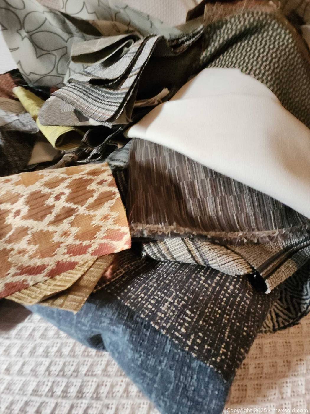 Assorted upholstery fabric scrap lot | Maxsold