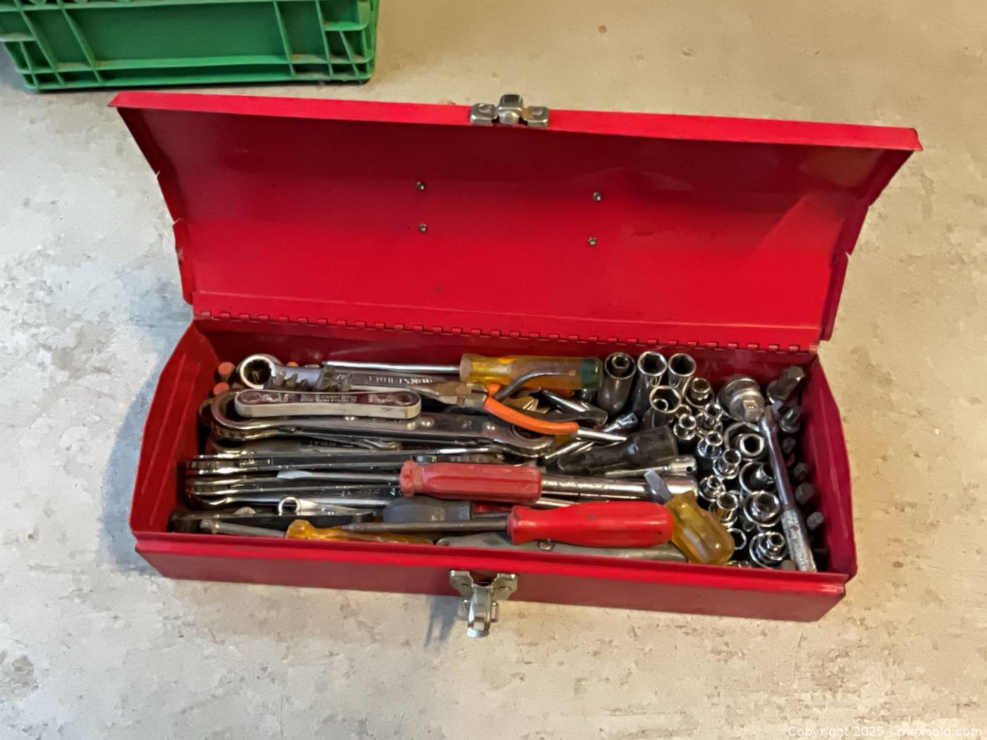 Red steel toolbox with assorted hand tools | Maxsold