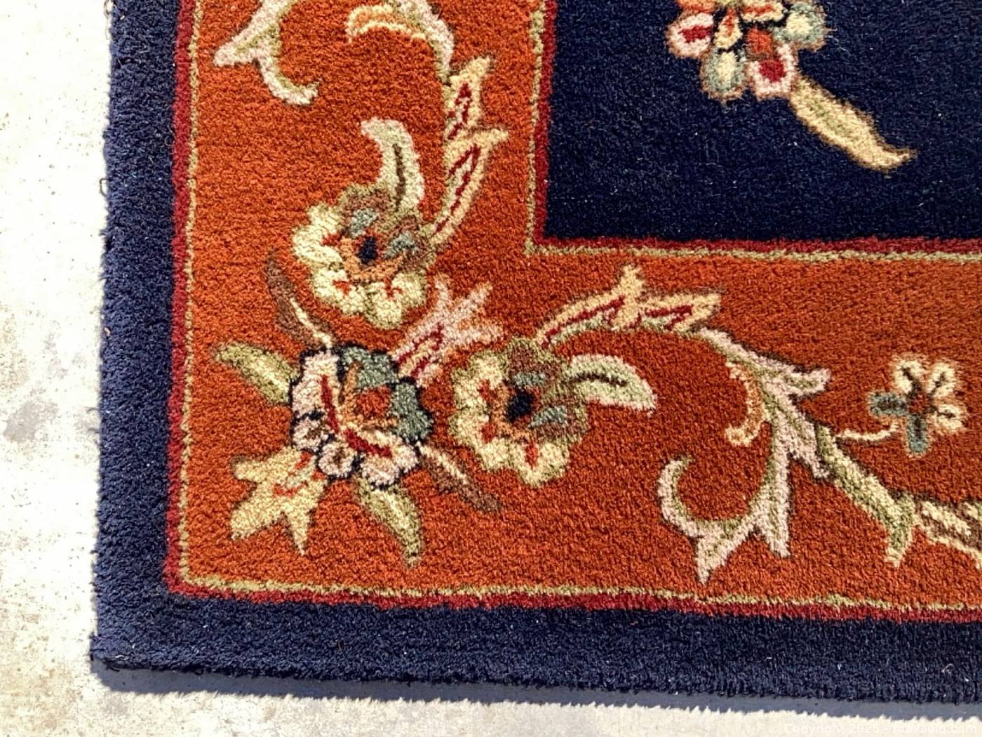 Navy and rust wool rug 7' x 9' | Maxsold