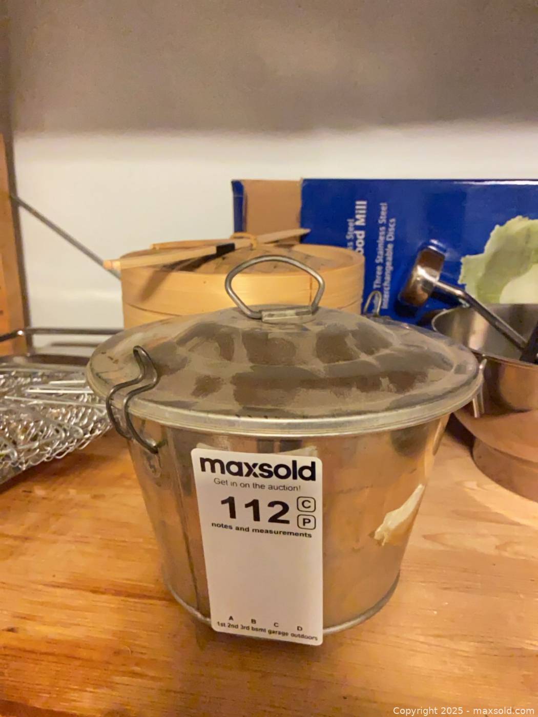 Assorted stainless cookware, cast iron grill pan, compost bucket | Maxsold