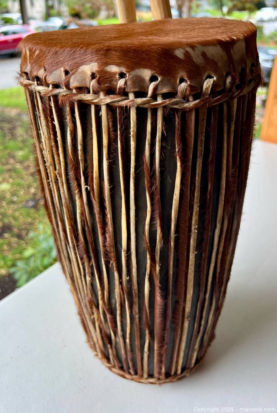 African tribal drum with drumsticks | Maxsold