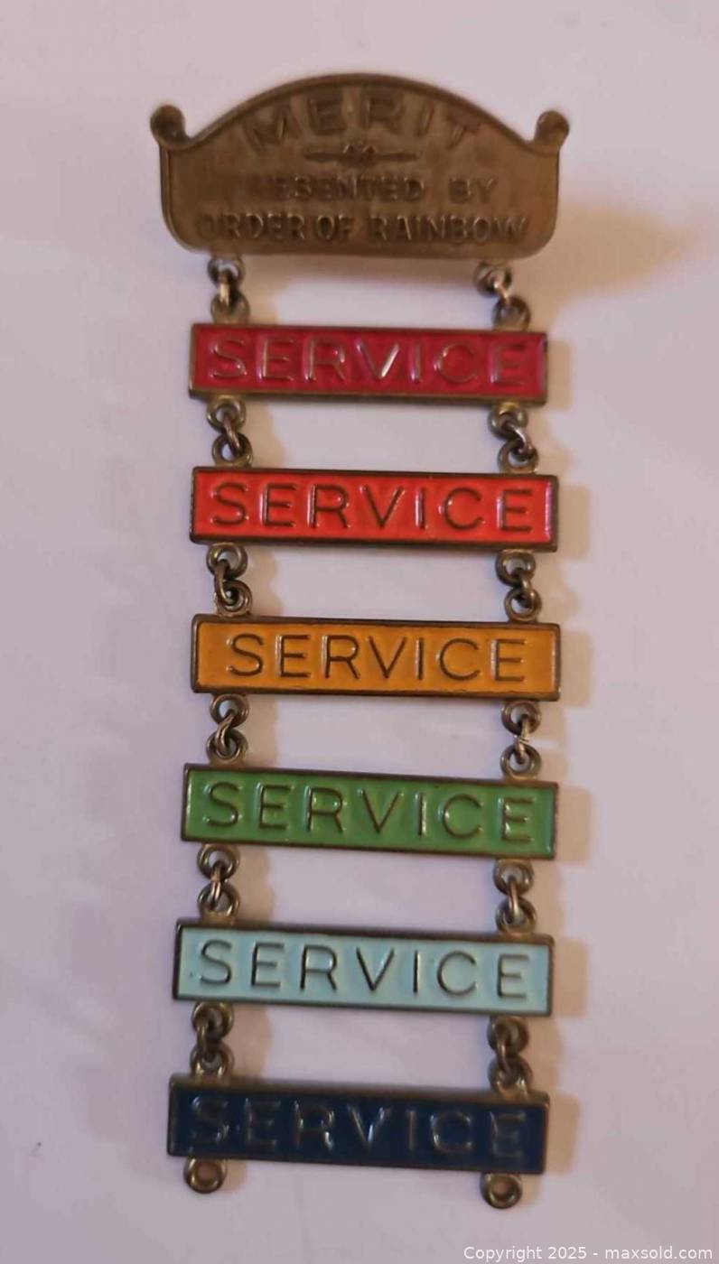 Assorted pins, pinbacks, buttons, box | Maxsold