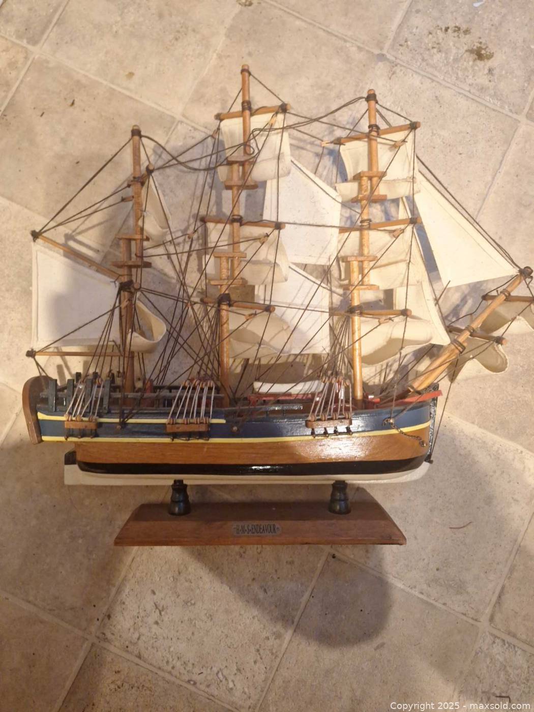 Wooden three-masted model sailing ship on stand | Maxsold