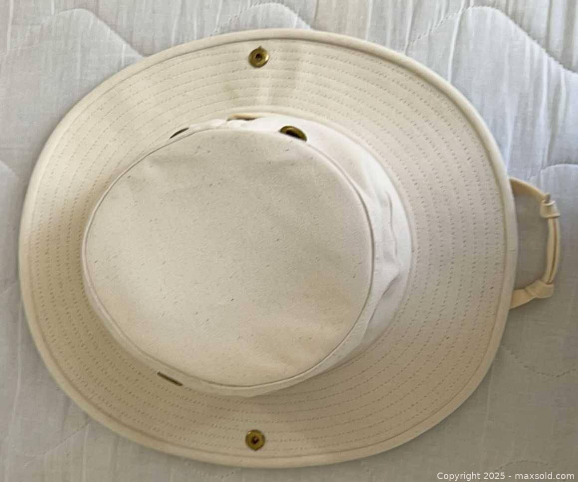 Tilley Endurables Hat With Six International Baseball Caps | Maxsold