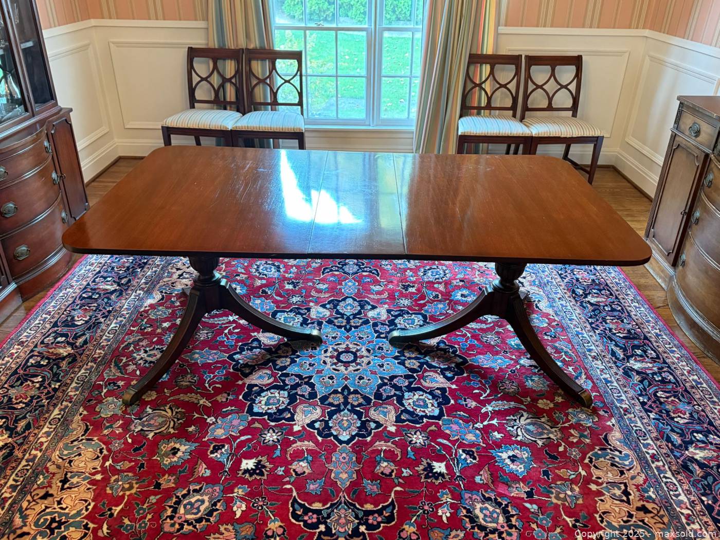 Mahogany twin pedestal dining table with leaf | Maxsold