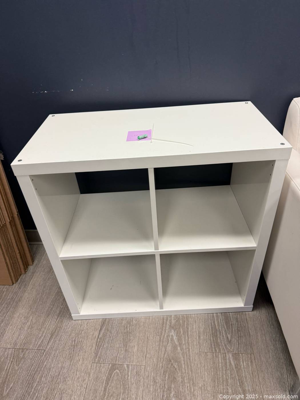 Three IKEA Kallax 2x2 high-gloss white shelving units | Maxsold