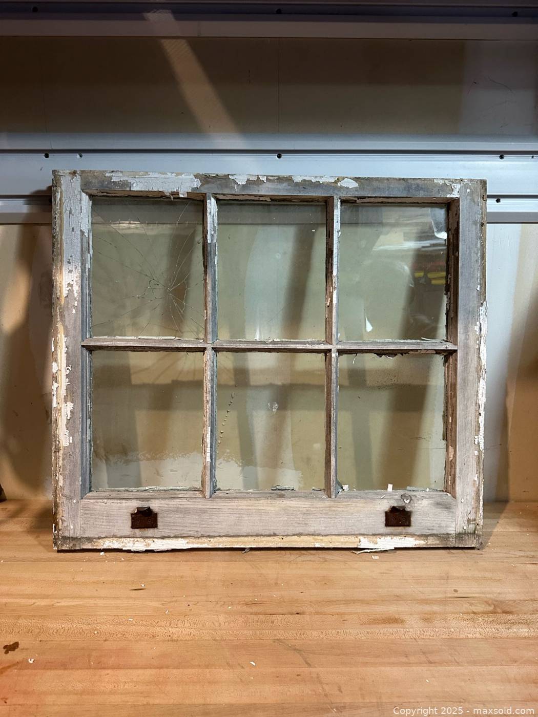 Vintage six-pane wooden window frame with aged glass | Maxsold