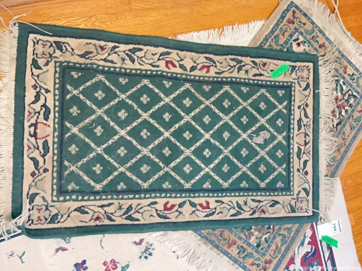 Man-made area rug and two mats | Maxsold