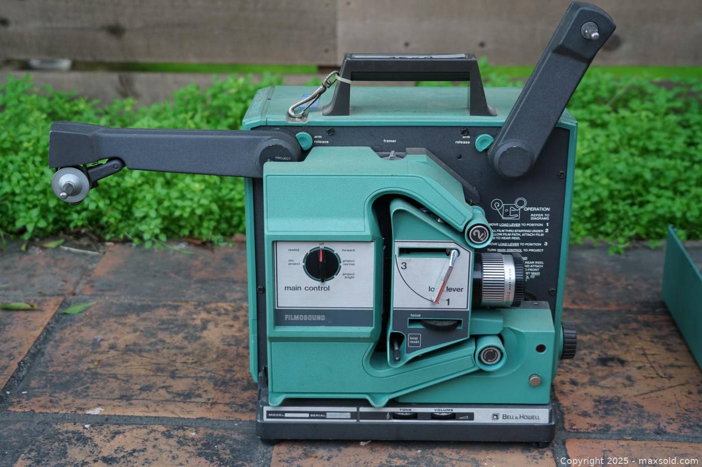 Bell & Howell Filmosound 1580 16mm projector with spare lamp | Maxsold