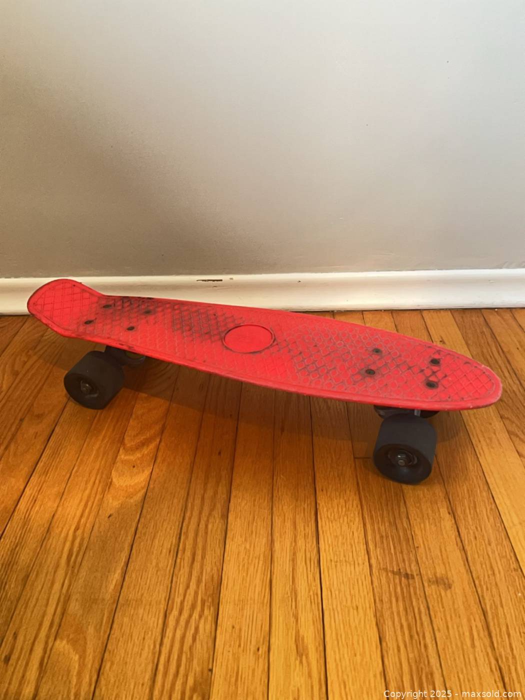 phat-red-plastic-skateboard-maxsold