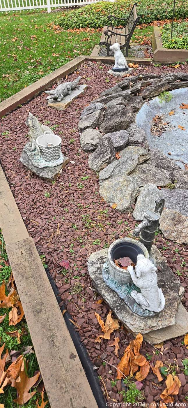 Spring Statues Four outdoor concrete and resin garden statues and planters | Maxsold