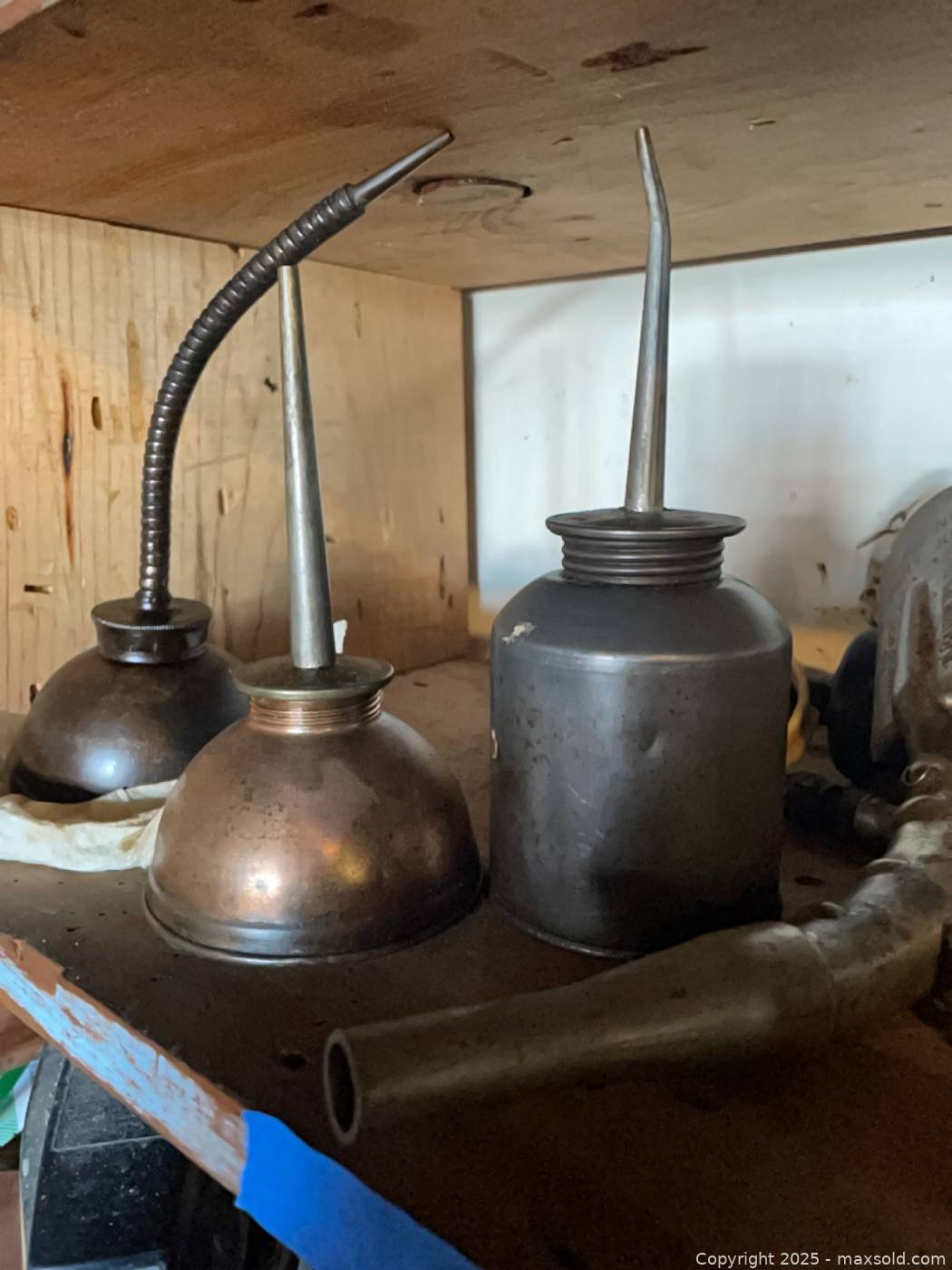 Vintage metal oil cans, funnels and grease gun | Maxsold