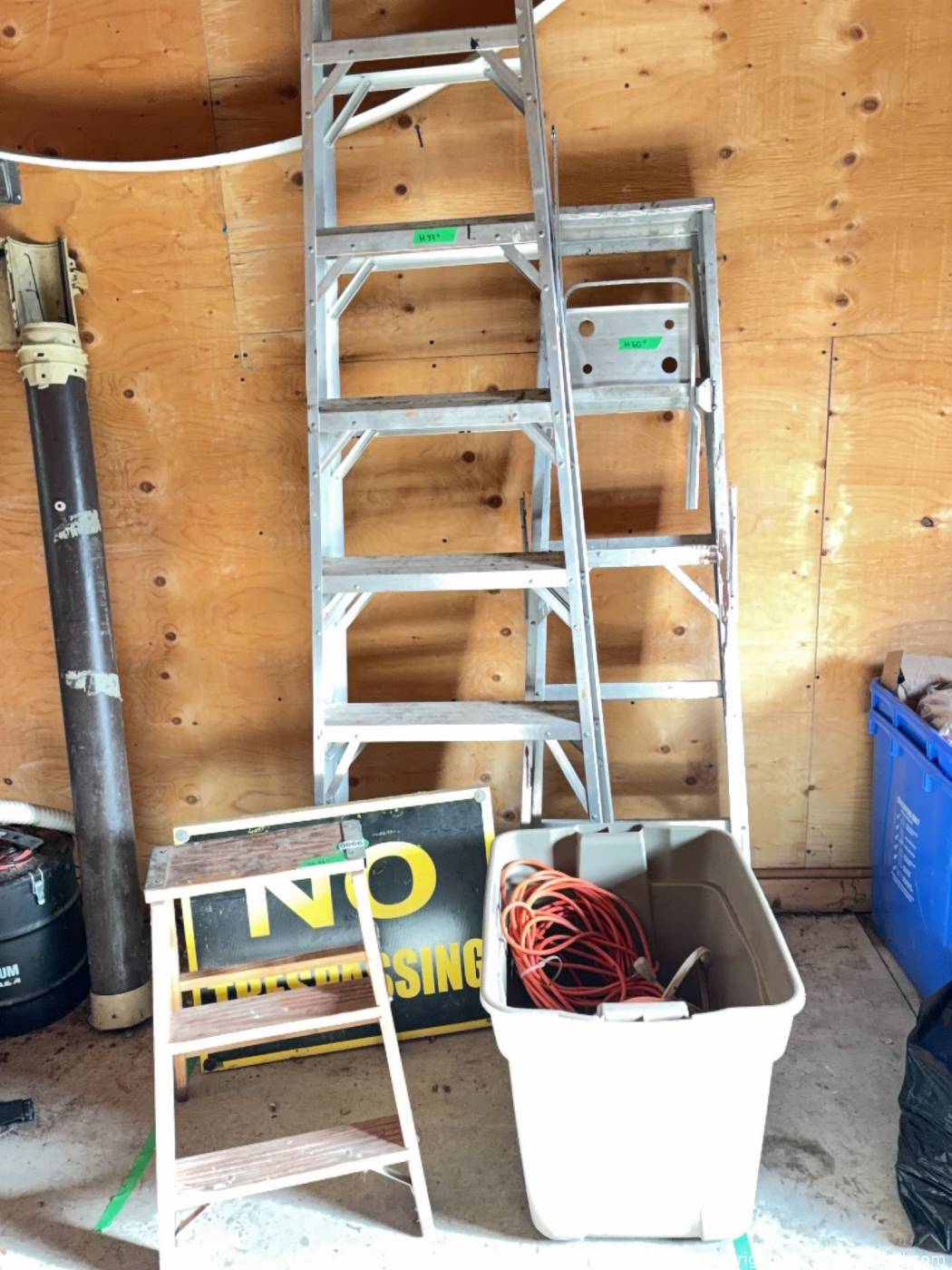 2 aluminum stepladders, wooden step stool, No Trespassing sign ...