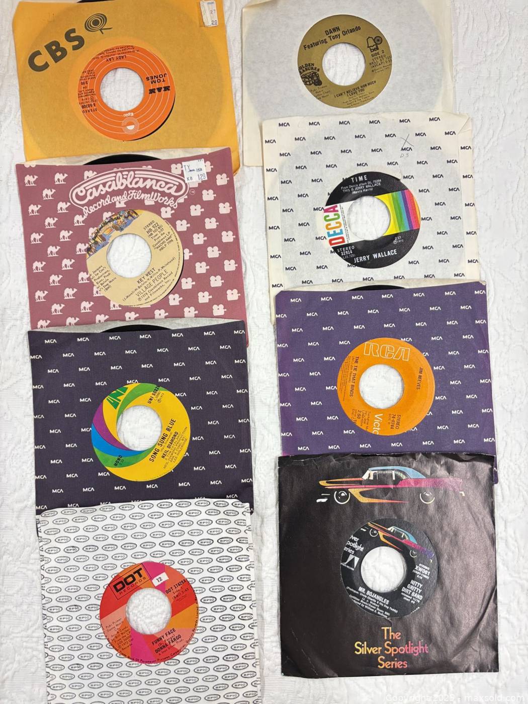 Lot of vintage 45rpm vinyl singles with adapters | Maxsold