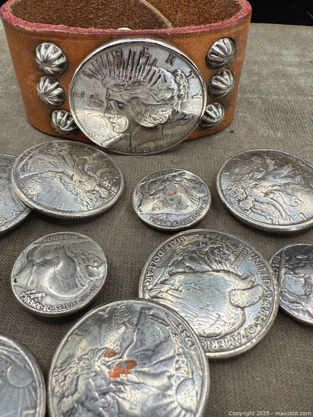 Assorted U.S. coin concho buttons and leather cuff | Maxsold