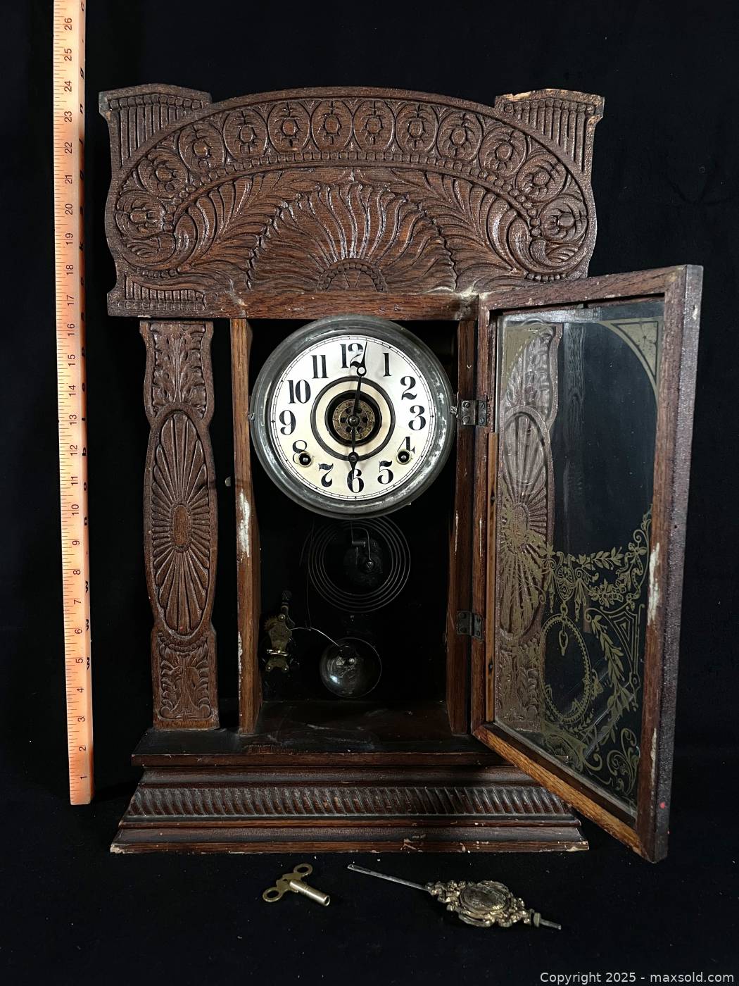 Antique carved wooden mantel clock with pendulum and key | Maxsold