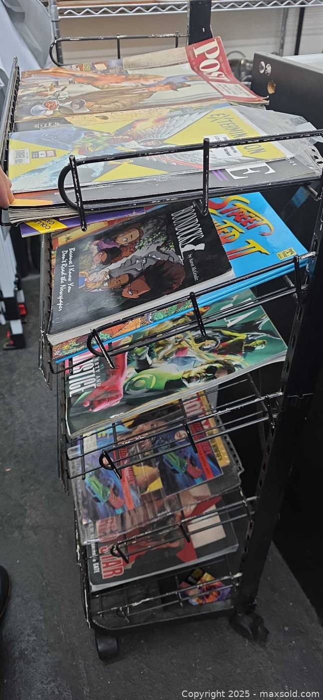 Comic Sale Rack Magazine rack with assorted comics and mags | Maxsold