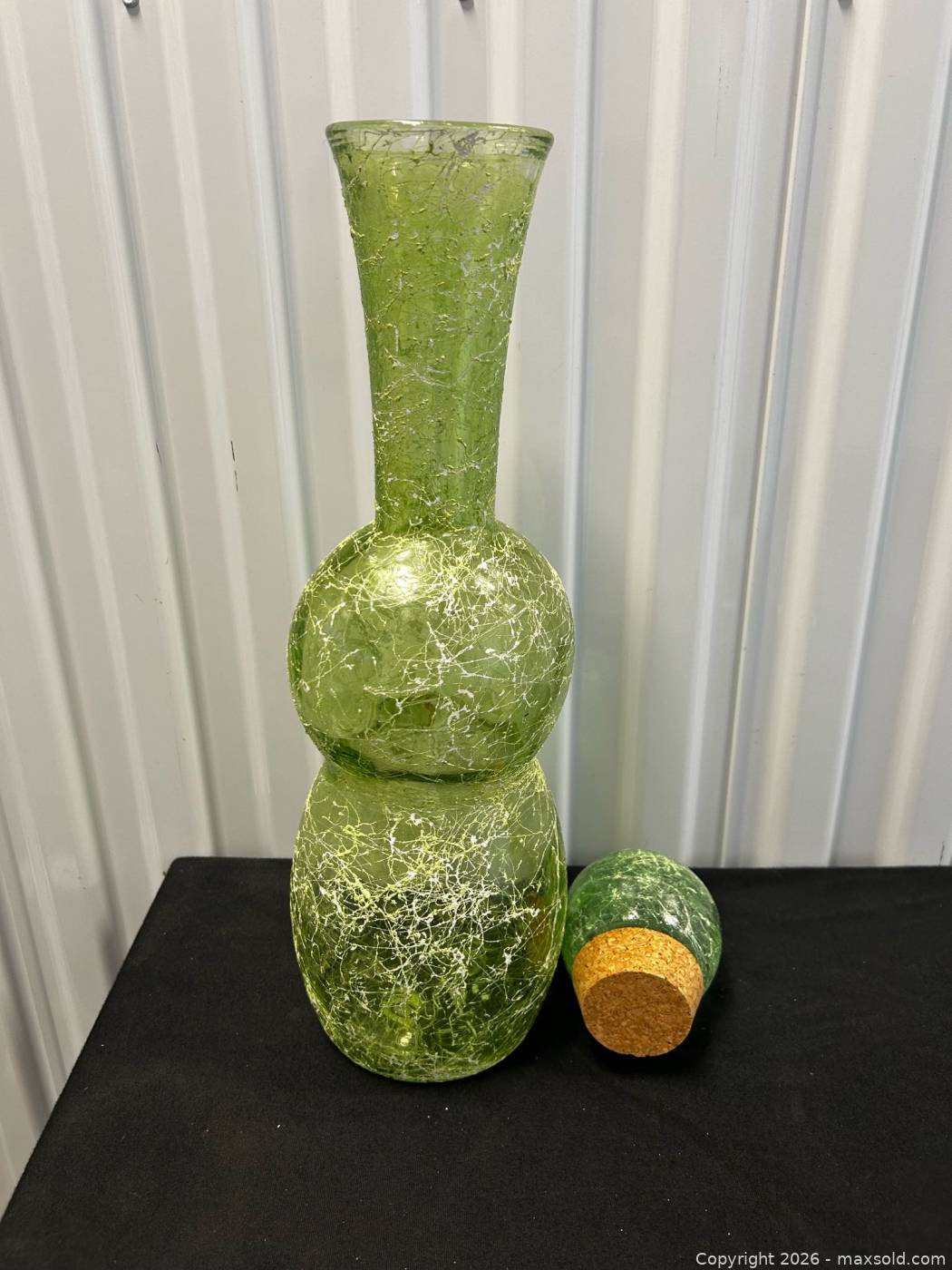 Canvas floral art, green crackle glass bottle and tall embossed metal ...