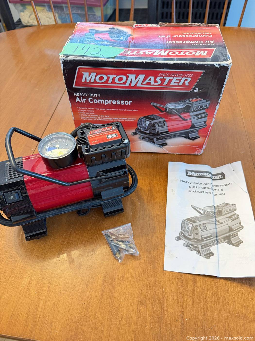 MotoMaster heavy-duty air compressor with manual and adapters | Maxsold