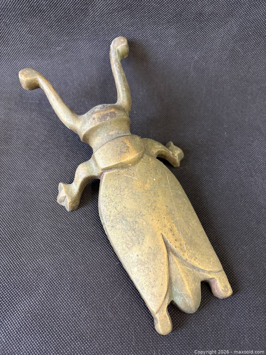 Dead Insect Boot Antique brass horned insect boot scrape door stop | Maxsold