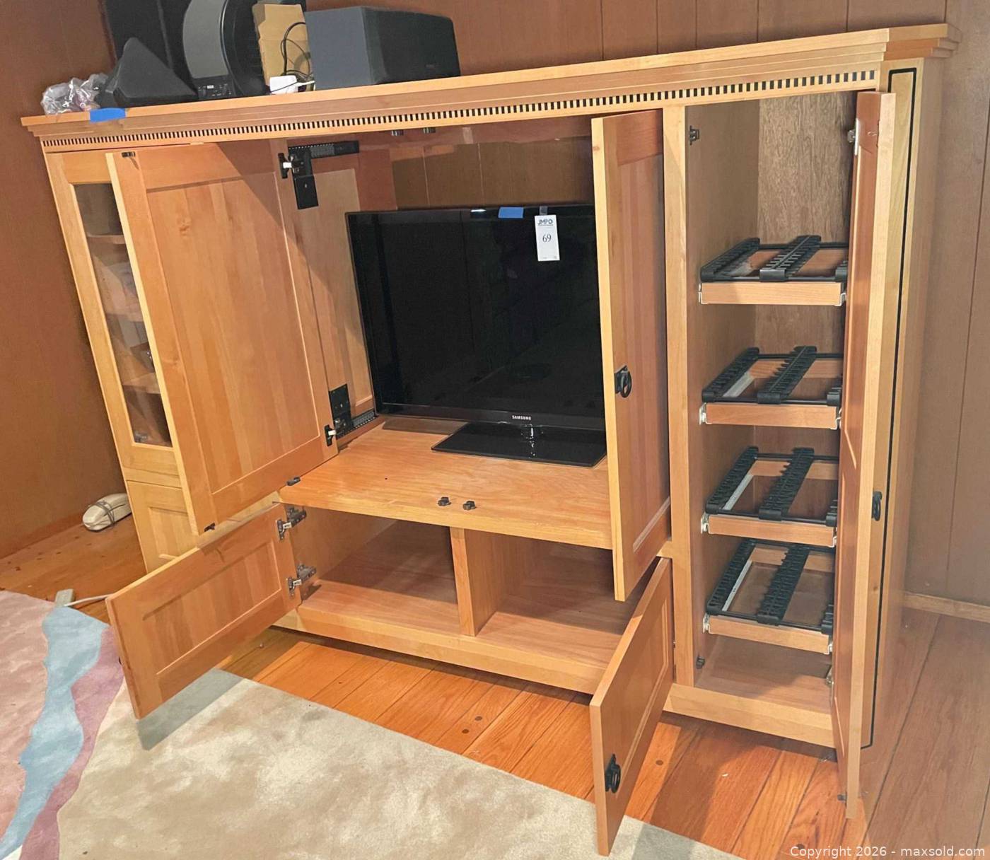Solid wood entertainment center | Maxsold