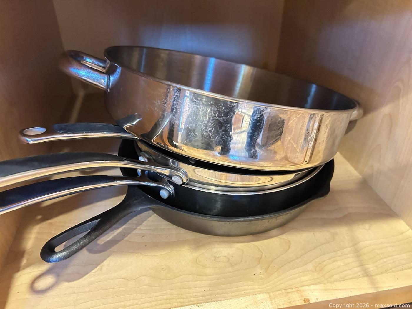 Stainless steel cookware and cast iron skillet | Maxsold