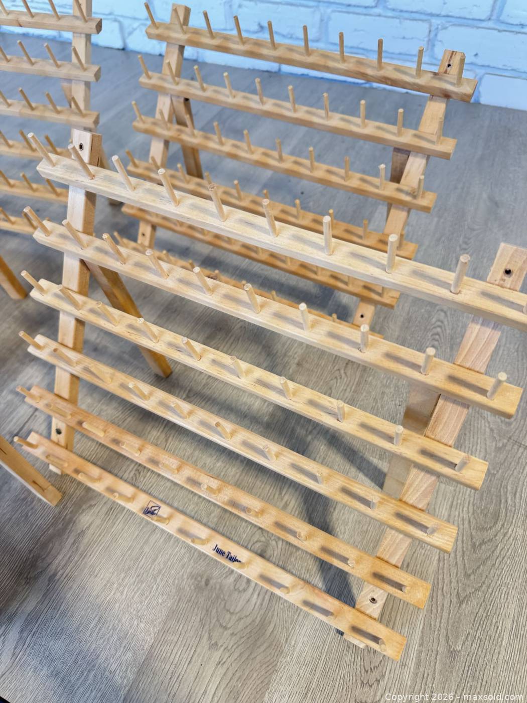 Five June Taylor wooden thread racks | Maxsold