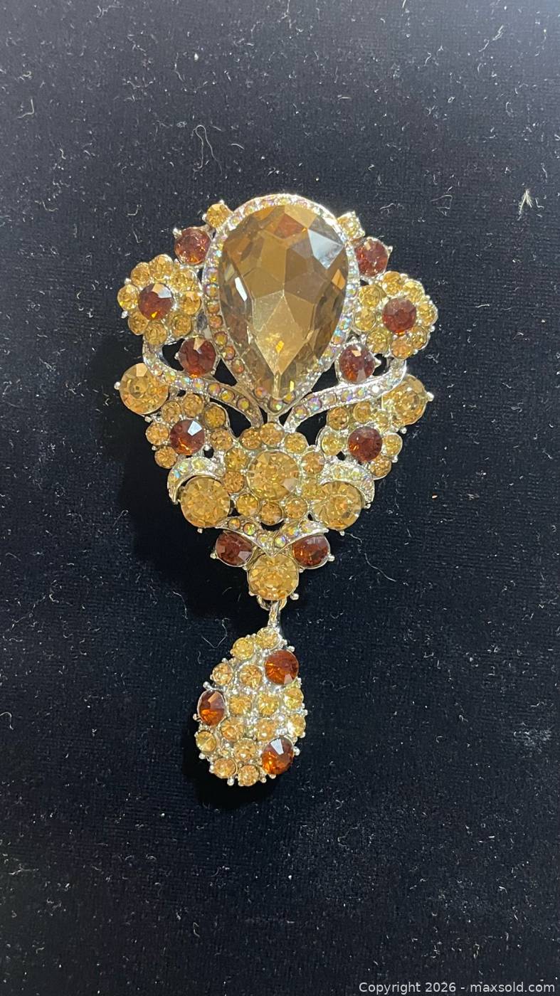 Large amber rhinestone brooch with drop | Maxsold
