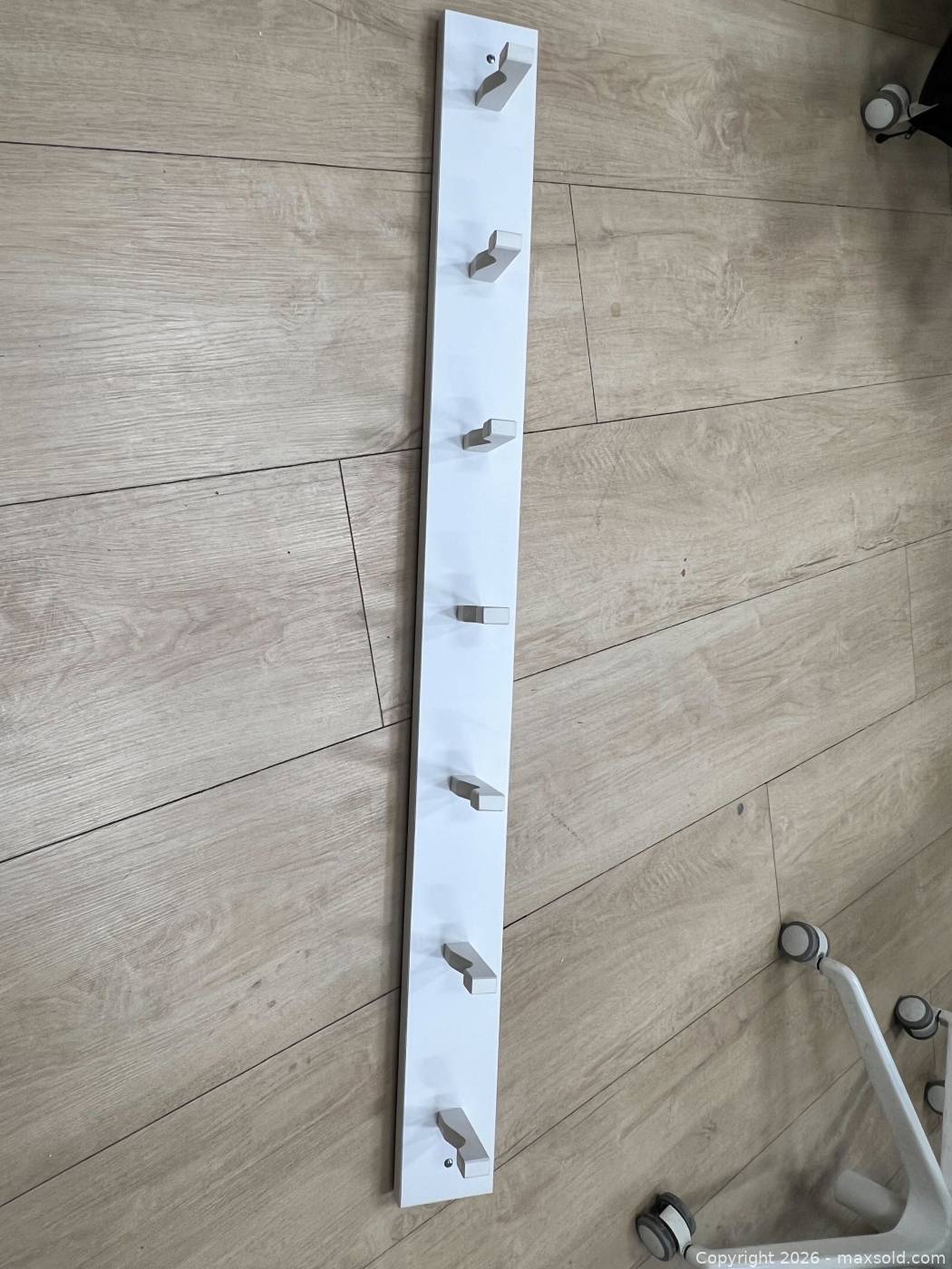 Two wall-mounted hook racks | Maxsold