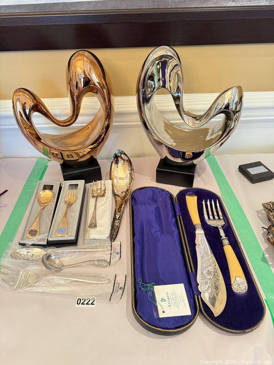 Pair abstract metal sculptures with 9 antique flatware pieces | Maxsold