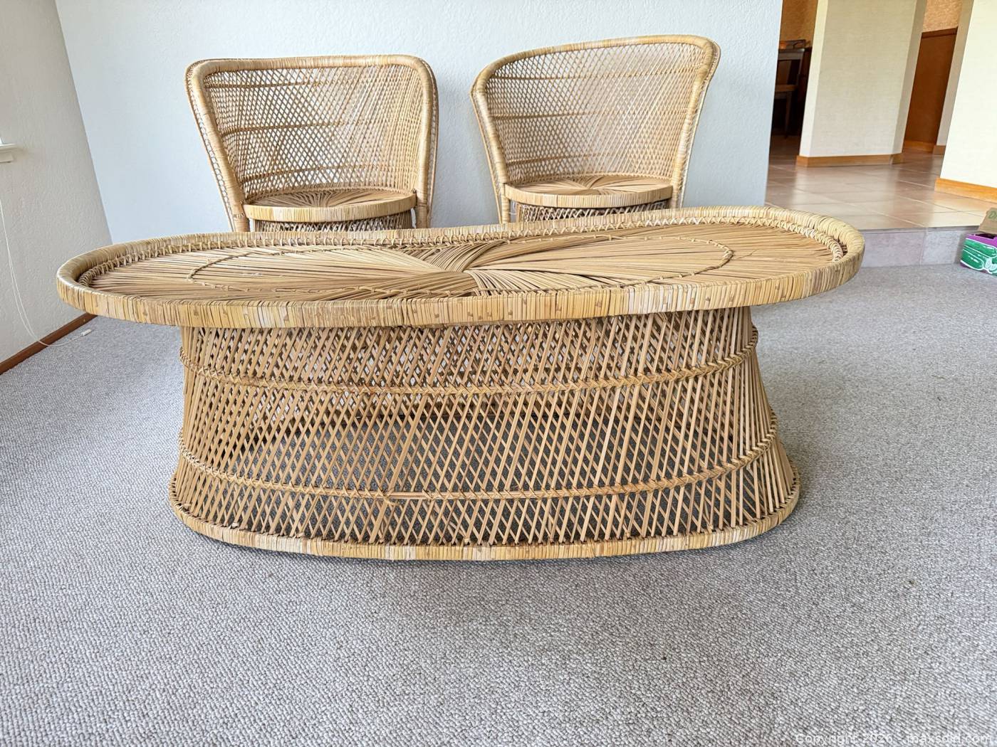 Rattan barrel chairs with matching oval coffee table | Maxsold