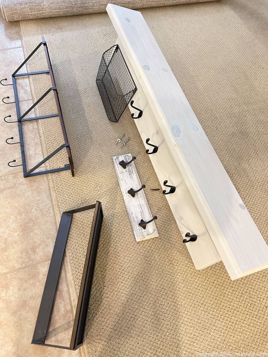 Five wall shelves with hooks and basket | Maxsold
