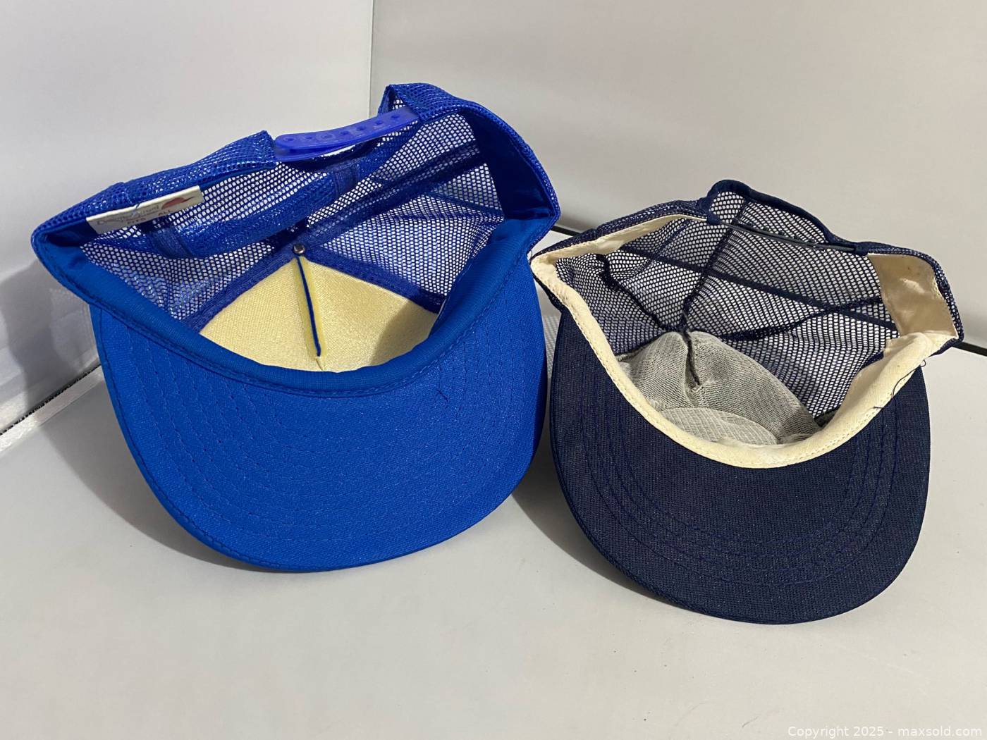 Lockheed and Raytheon adjustable baseball caps | Maxsold